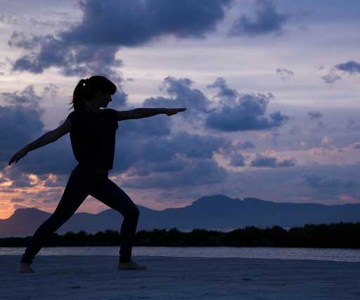 girl yoga on beach