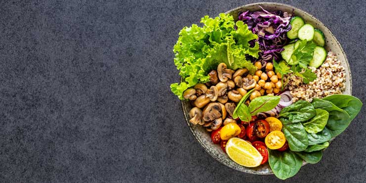 quinoa-mushrooms-lettuce-red-cabbage-spinach-cucumbers-tomatoes-bowl-buddha-dark-top-view_127032-1963